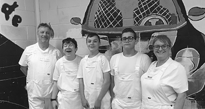Children in the school kitchen with the chefs